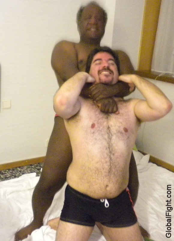black man strangling white slave guy