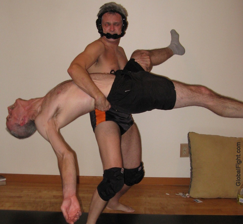 collegiate wrestling dude beating up older man