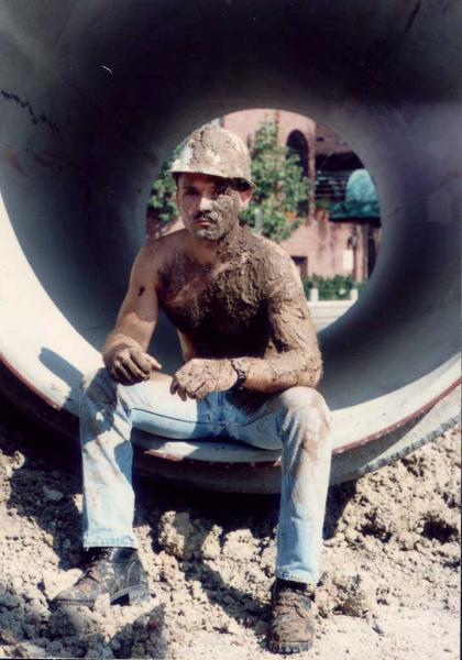 construction man full of mud wrestling jeans