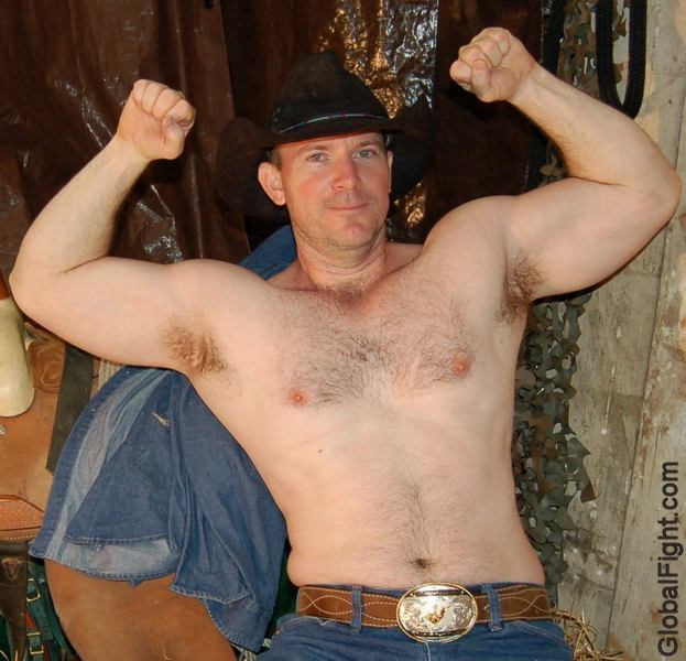 cowboy flexing big biceps barn shirtless gear fetish