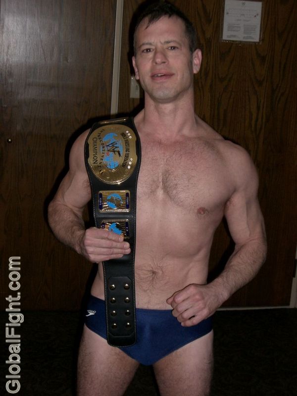 pro wrestler belt posing